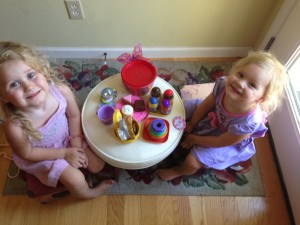 Ava making a tea party for her sister